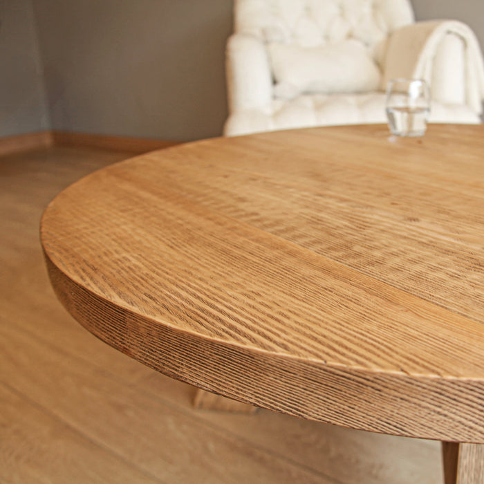 Close-up view of the tabletop from the front, showcasing the wood grains and edges, highlighting the rustic charm and natural beauty of the reclaimed pine.