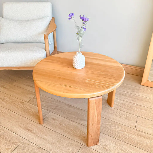 Close-up of the Luna Minimalist Round Coffee Table’s solid wood grain, highlighting its natural texture and craftsmanship.