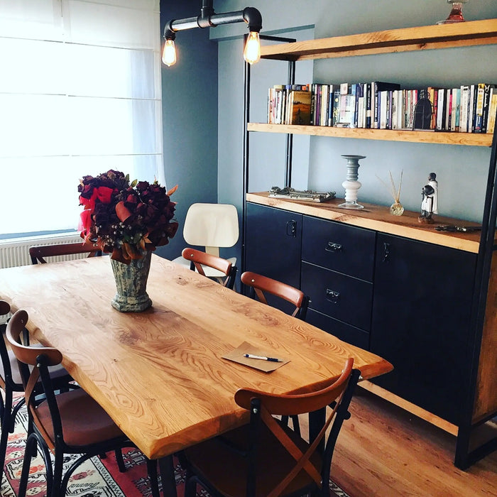 Marcel chestnut dining table featuring smooth, polished solid wood surface with organic wavy edges.