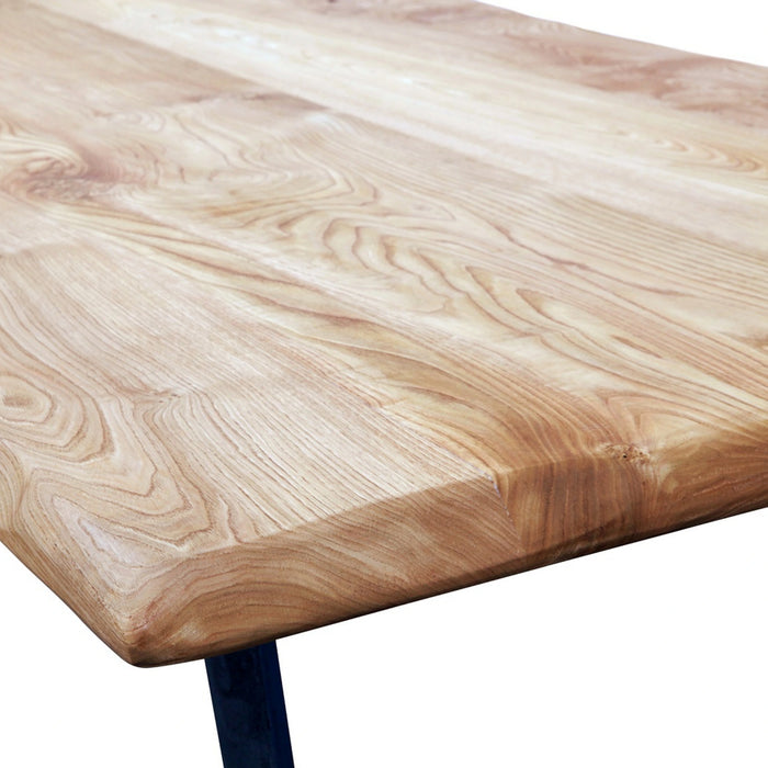 Side view of the handcrafted dining piece highlighting the smooth lines and rich texture of the natural wood, emphasizing its artisanal craftsmanship.