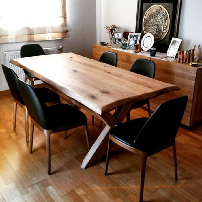Full view of the dining piece made from chestnut wood, placed in a modern dining room with a spacious layout, highlighting its elegant design and natural finish