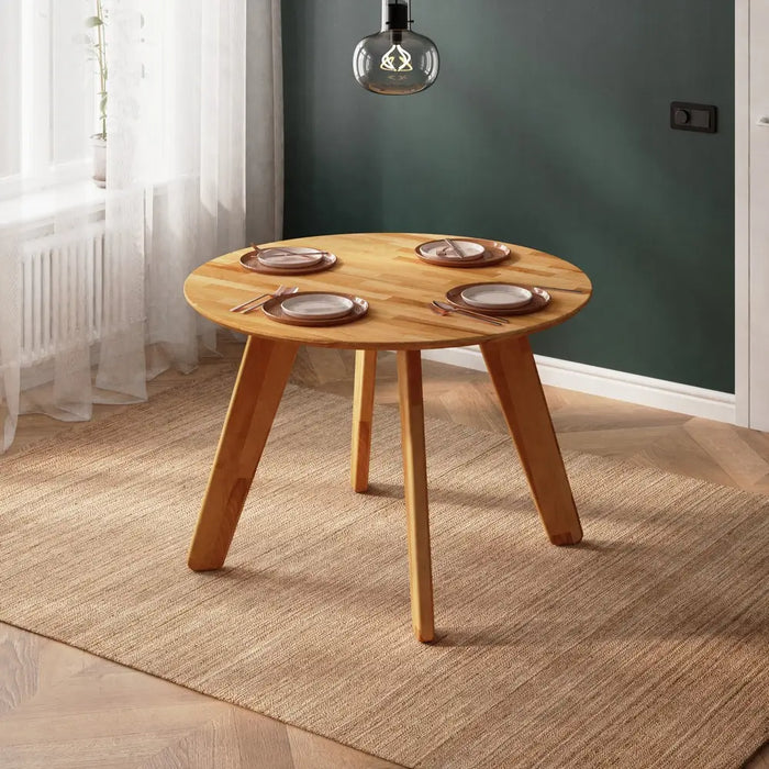 Top-down view of the Monroe Solid Wood Round Kitchen Table showcasing its smooth wooden surface and modern design.