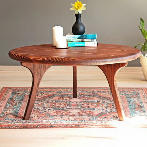 Close-up view of a Solid Pine Wood Mid Century Round Coffee Table showcasing smooth wood grain and sleek design.