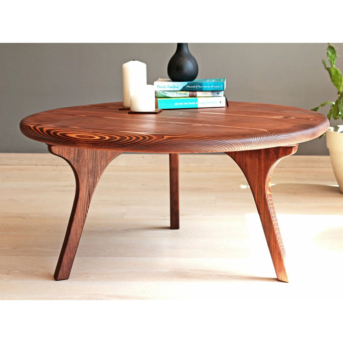 Top-down perspective of the Solid Pine Wood table, emphasizing the circular design and rich wood texture.