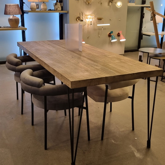 The Belgrade Rustic Farm Dining Table in a well-lit dining room, showcasing its inviting design and versatility in any space, perfect for family meals and gatherings.