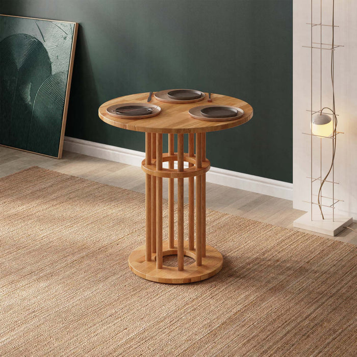 Close-up of the Grant Small Dining Table for 2, highlighting its smooth round beech wood surface in a modern minimalist kitchen setting.