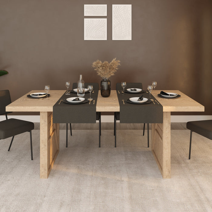 The dining table set in a farmhouse-themed dining room with soft lighting, capturing the elegant yet practical design of the Helena table.