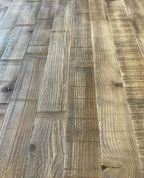 Warm, rustic tones of the Montpelier Pine hardwood dining table with a robust trestle base.