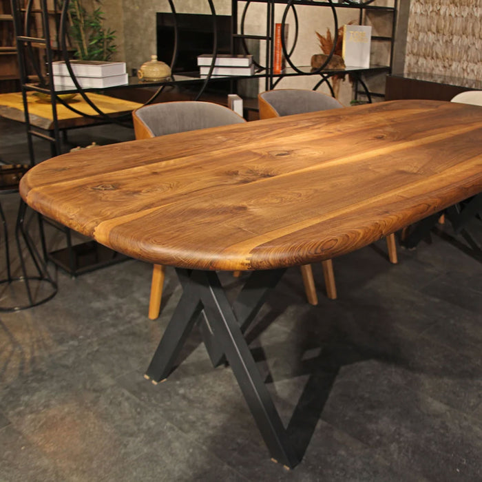 Toledo walnut dining table placed in a well-lit dining room, enhancing the room’s modern aesthetic.