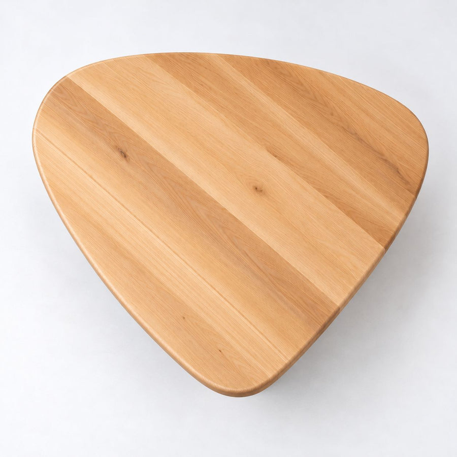 Yuma Organic Triangle Beech Wood Coffee Table with rounded corners, featuring a natural light brown wood grain pattern, shown on a plain white background.