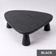 Yuma Organic Triangle Beech Wood Coffee Table with a black wood grain finish, featuring a rounded triangular top and three tapered cylindrical legs, shown on a light gray background with a 'BLACK' label in the bottom right corner.