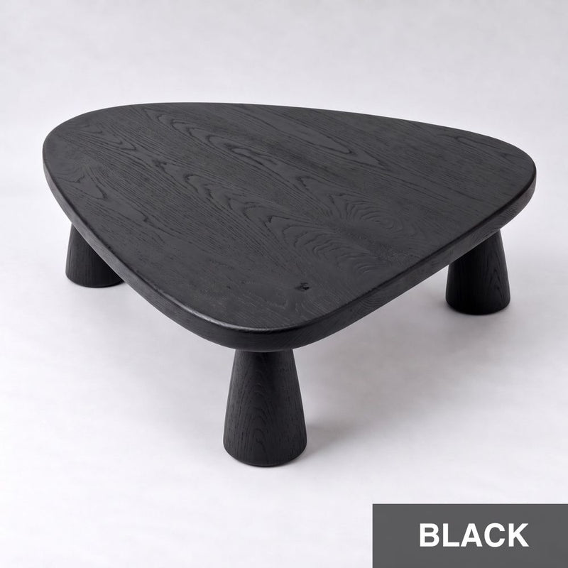 Yuma Organic Triangle Beech Wood Coffee Table with a black wood grain finish, featuring a rounded triangular top and three tapered cylindrical legs, shown on a light gray background with a 'BLACK' label in the bottom right corner.