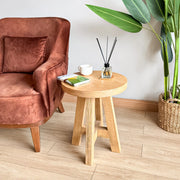 Round Farmhouse Side Table with a cozy armchair