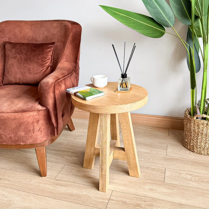 Round Farmhouse Side Table with a cozy armchair