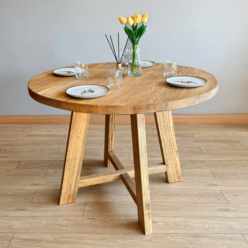 Front top view of the solid wood farmhouse dining table with plates on it 