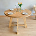 Amber Round Farmhouse Dining Table with different wood finish options, demonstrating versatility.