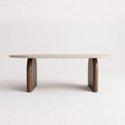Arden Oval Travertine Coffee Table with Walnut Base - Sculptural Mid-Century Design Straight-On Studio View by Tomruque