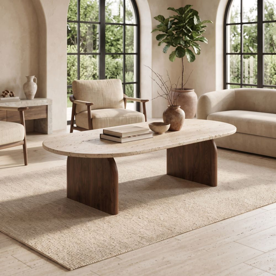 Arden Oval Travertine Coffee Table with Walnut Base - Sculptural Mid-Century Design Styled in a Living Room by Tomruque