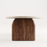 Side Profile Studio View of Arden Oval Travertine Coffee Table with Walnut Base - Sculptural Mid-Century Design by Tomruque