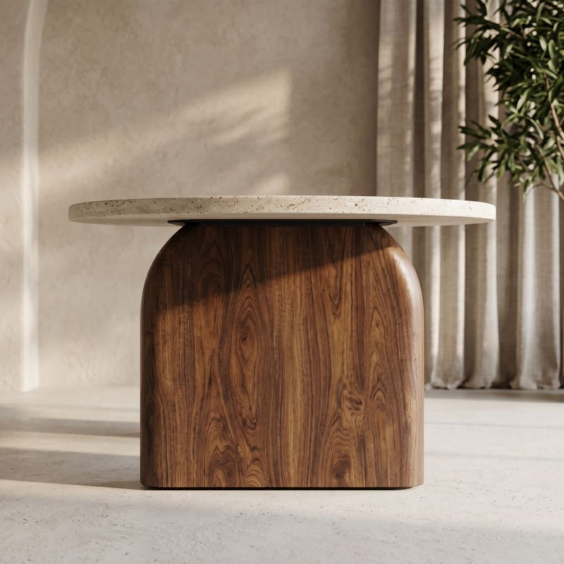 Side View of Arden Oval Travertine Coffee Table with Walnut Base - Sculptural Mid-Century Design Styled in a Room by Tomruque