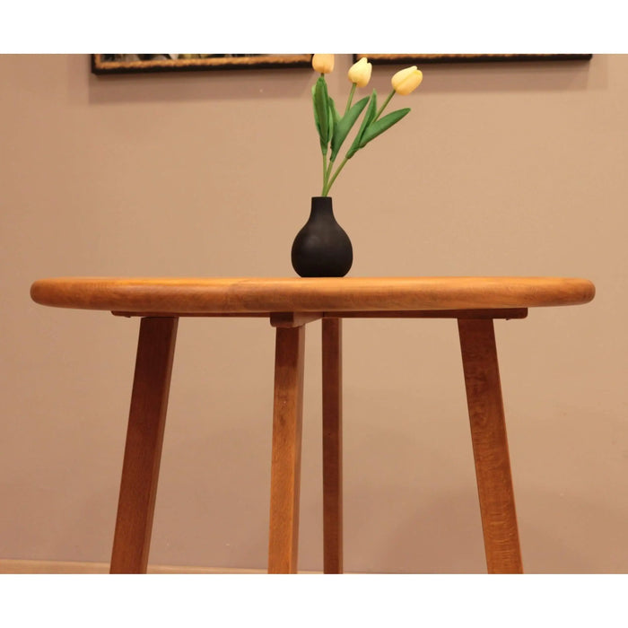 Zoomed-in shot of the natural beech wood grain on the Axis Dining Table, highlighting its unique texture