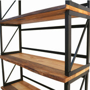 Wide-angle photo of the Band Walnut Bookcase in a living room, blending rustic and industrial styles in a home setting.