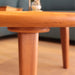 Close-up of the Bliss round wood cocktail table's natural wood grain and expert craftsmanship.