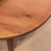 Bliss round wood cocktail table in an airy, sunlit room, complementing a mid-century modern aesthetic.