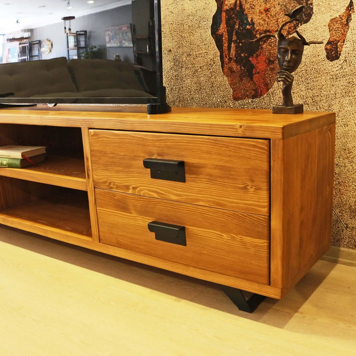 Wooden TV stand styled in a modern living room, paired with a flat-screen TV and minimalist decor.