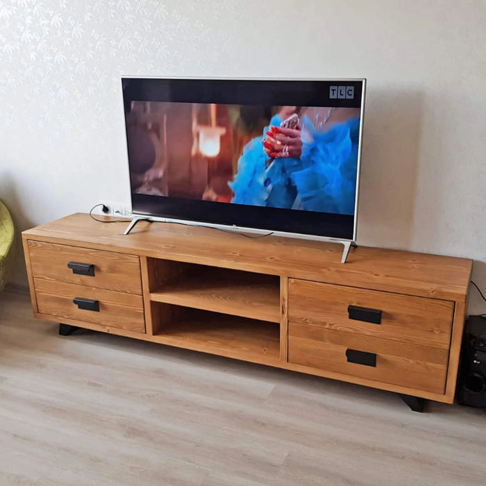 Wide-angle shot of a living room with the TV stand as the centerpiece, complementing various decor styles.