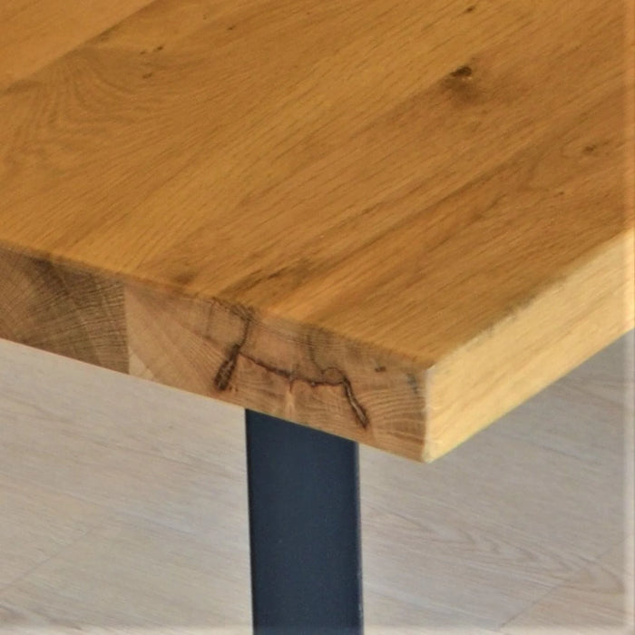 Side view of the dining table, highlighting its sturdy frame and elegant design