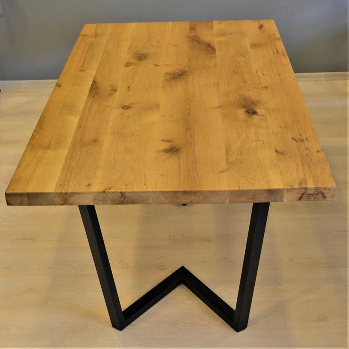 dining table set for a family gathering, showcasing its spacious design and natural wood finish