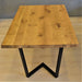 dining table set for a family gathering, showcasing its spacious design and natural wood finish