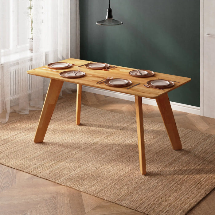 Reclaimed wood rectangular dining table with a smooth, polished surface, adding timeless charm.