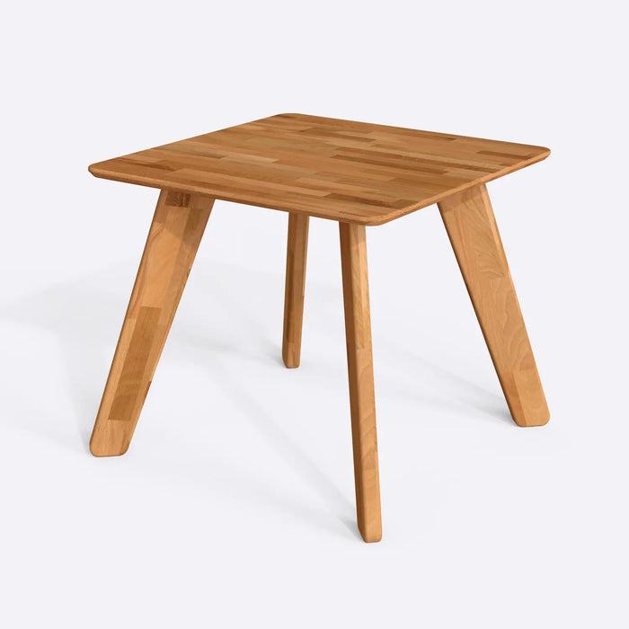 A sleek square dining room table highlighting the natural wood grain and sturdy craftsmanship.