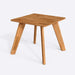 A sleek square dining room table highlighting the natural wood grain and sturdy craftsmanship.