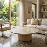 Dune Round Travertine Coffee Table - Sculptural Modern Pedestal Design in a Modern Living Room by Tomruque