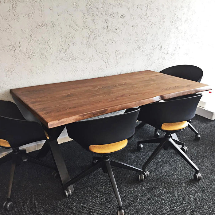 Eagan dining table set with stylish chairs in a cozy dining space, demonstrating its perfect balance of rustic charm and modern design.