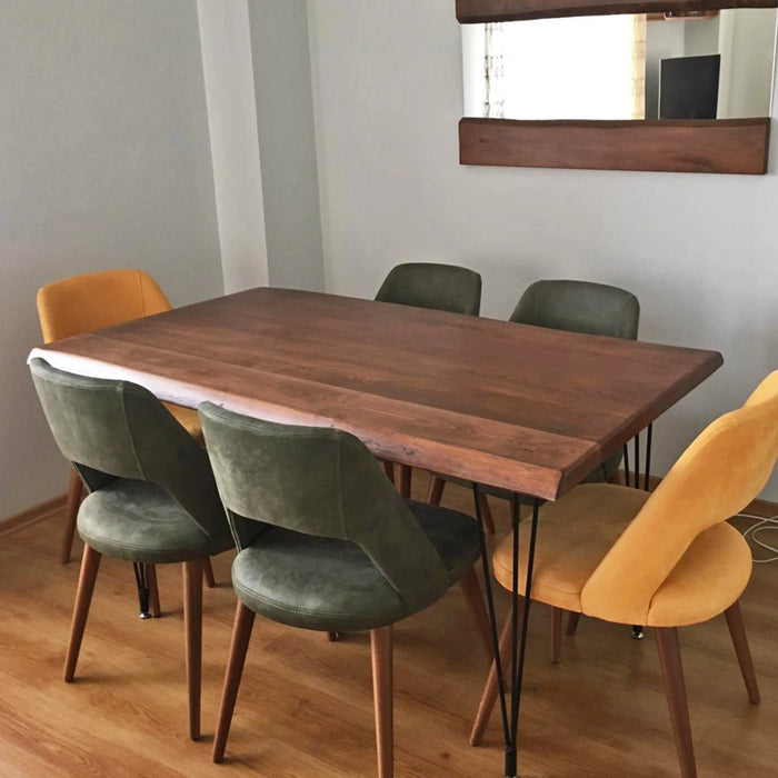 Close-up of the Eagan dining table with chairs, highlighting the seamless integration of the wood and metal design, ideal for family gatherings.