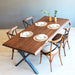 Top view of the Eagan dining table showcasing its smooth pine wood surface and sturdy metal legs