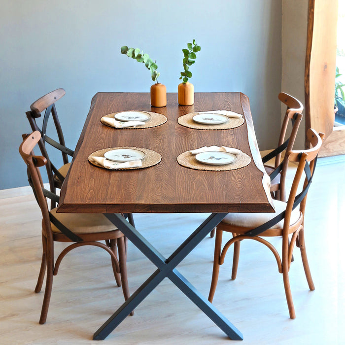 Dining room setup featuring the Eagan table paired with modern chairs in a cozy space.