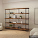 The Ellis bookshelf in a modern living room setup, showcasing its versatile storage capabilities for books, plants, and decorative items.