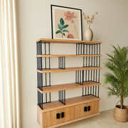 Fargo Solid Pine Wood Bookcase with Cabinet Storage and two lower cabinet doors, styled in a room setting with a framed print, vase, and potted plant.