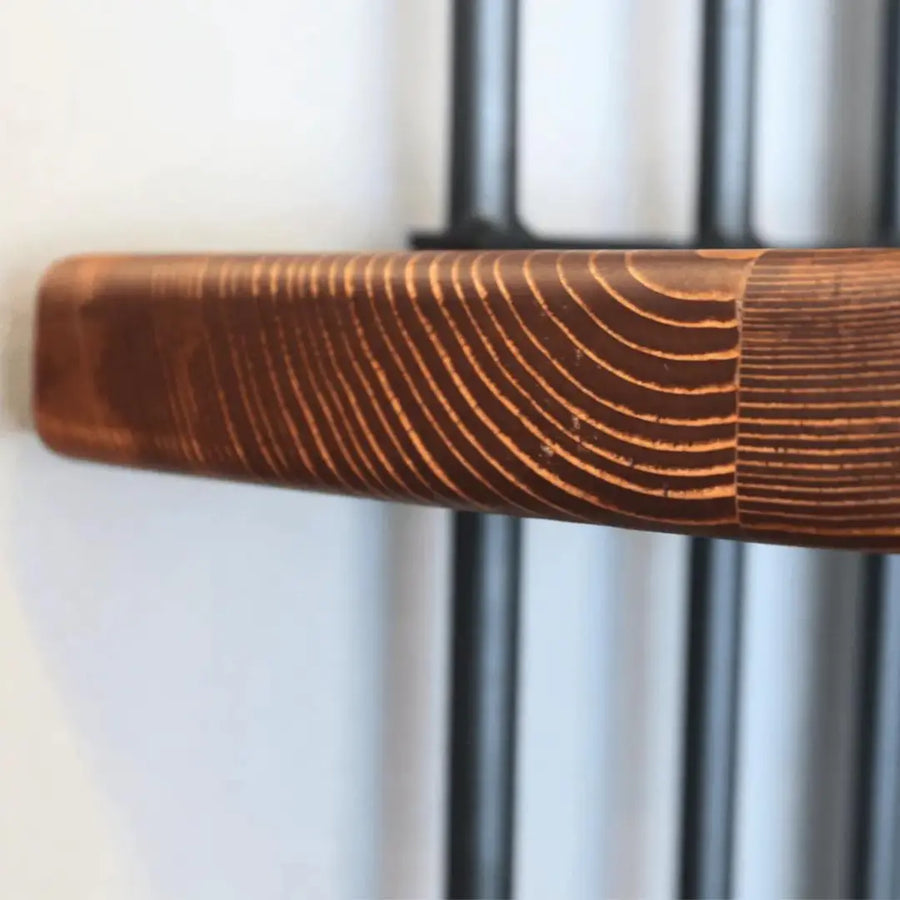 Side view of the Fargo corner bookcase demonstrating its compact design for corner placement.