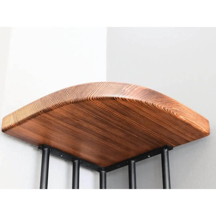 Angled view of the Fargo corner bookcase highlighting the interplay of solid wood and metal elements.