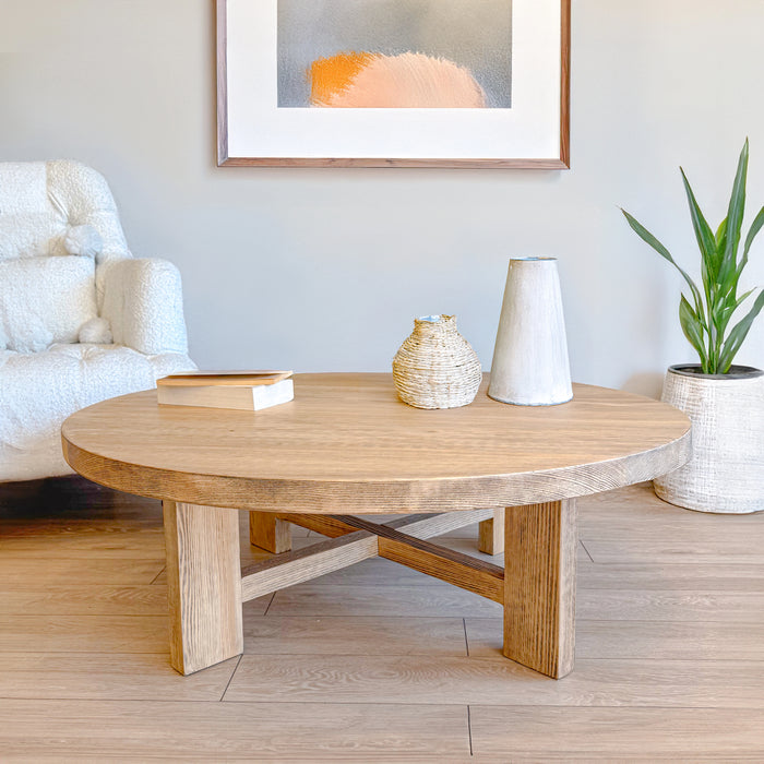  A high-angle shot of the Harlow coffee table with a rustic lamp, highlighting its warm, inviting feel.