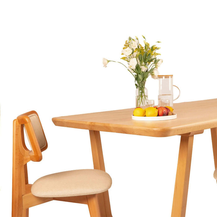 Close-up of the smooth beech wood tabletop, highlighting its natural grain and premium craftsmanship.