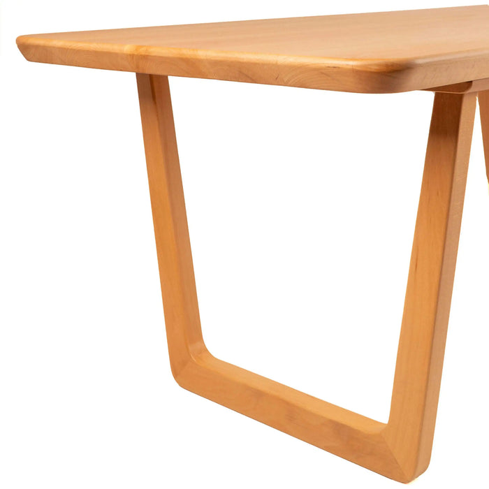 View of the table from a dining chair perspective, capturing its generous legroom and comfortable proportions.