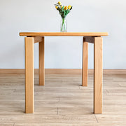 Side view of the legs of the minimalist dining table