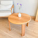  Close-up of the Luna Minimalist Round Coffee Table’s solid wood grain, highlighting its natural texture and craftsmanship.